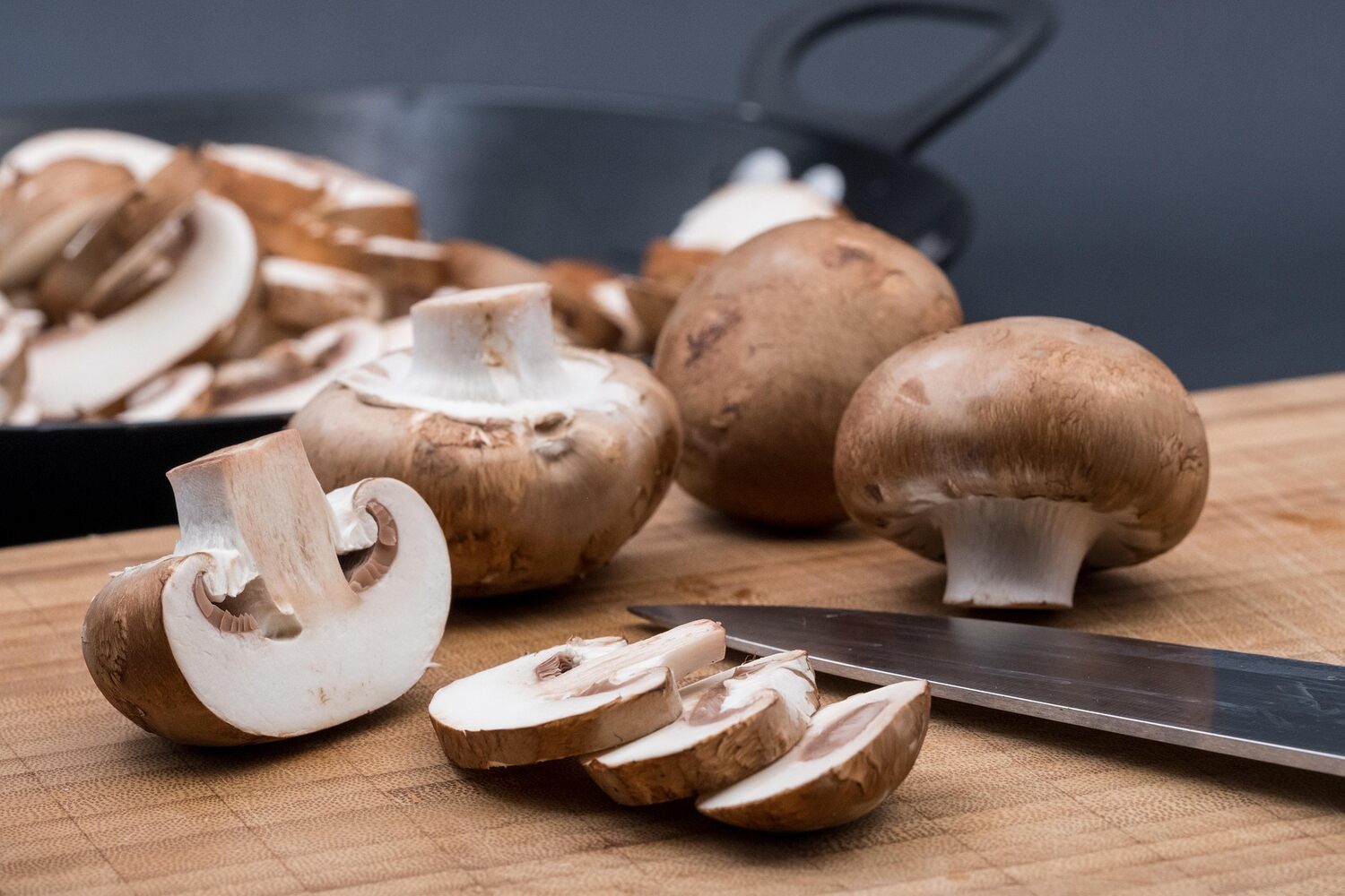 chopping mushrooms in the kitchen for a mushroom stew recipe